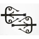 A pair of massive Aesthetic Movement wrought-iron hinges in the manner of Dr Christopher Dresser,