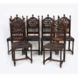 A set of six Gothic Revival chairs, with tracery 'Rose' backs, turned front legs and padded