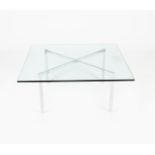A modern Barcelona chrome framed table originally designed by Lilly Reich and Mies van der Rohe,