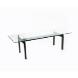 A Cassina LC6 enamelled metal and glass dining table designed by Le Corbusier, originally designed