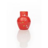 A rare Moncrieff's Monart Ware vase, milky off-white liner cased in red with millefiori cane