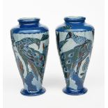 A pair of Charles Brannam Barum vases, dated 1930, shouldered, flaring cylindrical form, incised and