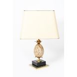 A Maison Charles style table lamp, stepped chrome and back square base supporting brass foliate