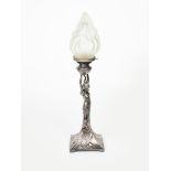 An Art Nouveau electroplated metal figural table lamp probably WMF, cast as a maiden holding up a