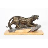 A patinated spelter model of a stalking tiger, on stepped rectangular base unsigned, 43.5cm. wide