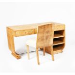 A Modernist satinwood desk and matched chair, rectangular top over three drawers, on one curved