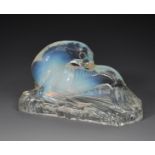 A Joblings Opalique opalescent glass model of a seal, modelled resting on a shaped rectangular