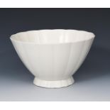 A Wedgwood Moonstone footed bowl designed by Keith Murray, footed, fluted form, covered in a matt
