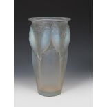 'Ceylan' No.905 a Lalique opalescent glass vase designed by Rene Lalique, modelled in relief,