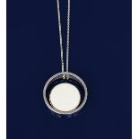 An Ib Bluitgen silver and ivory pendant necklace, model no.11A, two joined silver discs, set with