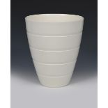 A Wedgwood Moonstone vase designed by Keith Murray, shape no.3842, flaring, ribbed bucket form,