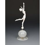 A glass figure of a woman by Istvan Komaromy, the white glass naked dancing figure, modelled