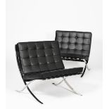 A pair of modern Knoll Barcelona chairs designed by Mies Van Der Rohe, chrome frame with black