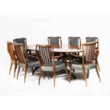 λ A rosewood veneer sideboard, extending dining table and eight chairs designed by Andrew John