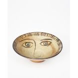 ‡ William Staite Murray (1881-1962) a stoneware footed bowl, painted with a face to the well in iron