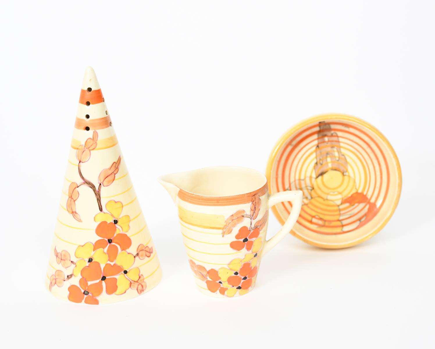 'Orange Hydrangea' a Clarice Cliff Bizarre Conical sugar sifter, painted in colours, an Orange