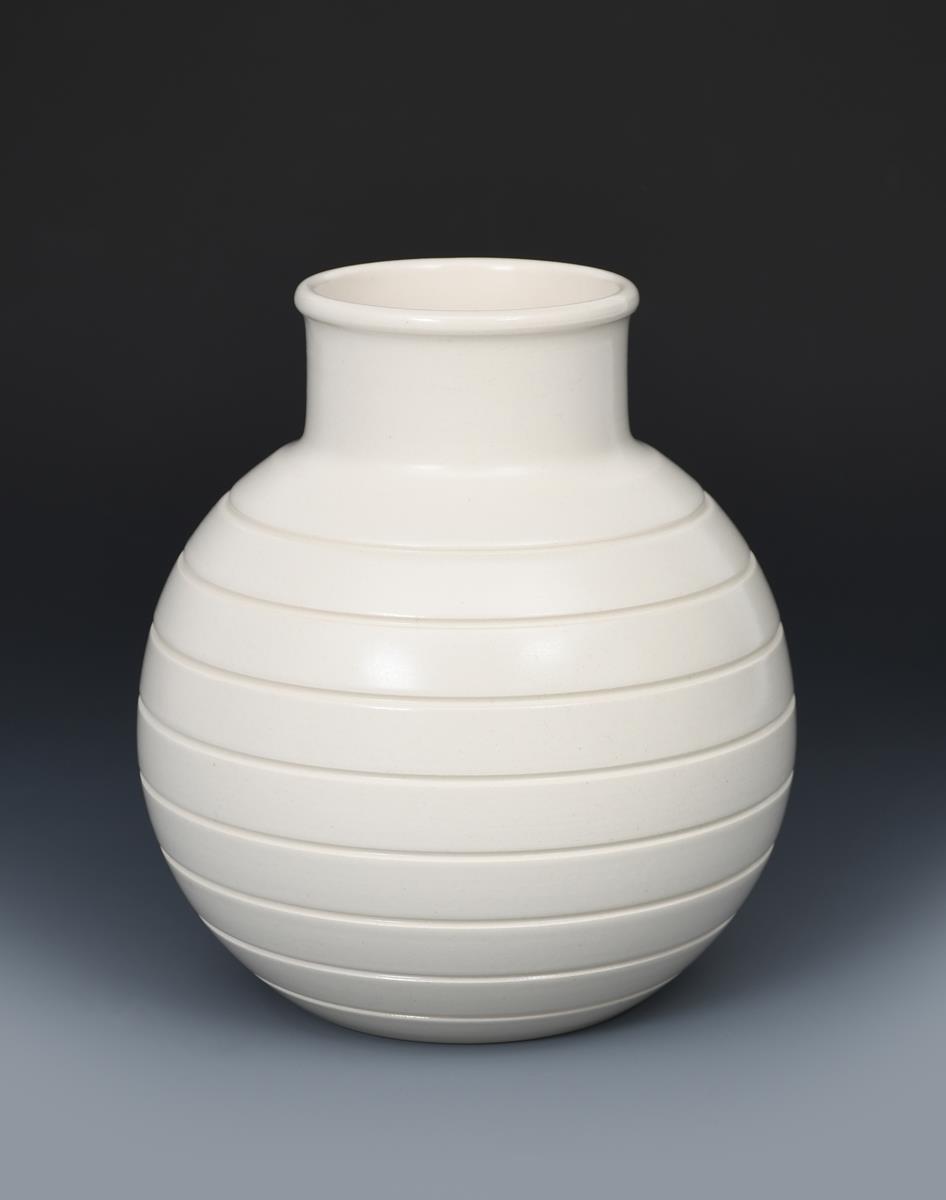 A Wedgwood Moonstone vase designed by Keith Murray, shape no.3801, ribbed ovoid form with collar