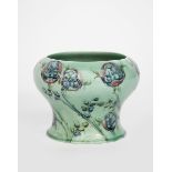 'Tudor Rose' a Moorcroft Pottery vase designed by William Moorcroft, retailed by Liberty & Co,