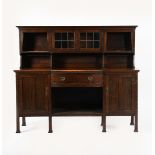 A Liberty and Co Milverton oak buffet sideboard, on square section legs, bow fronted base with