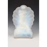 An opalescent glass table lamp probably Sabino, cast as a naked maiden before a clam shell, riding