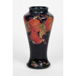 'Pomegranate' a tall Moorcroft Pottery baluster vase designed by William Moorcroft, shouldered form,