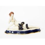 A Royal Dux model of an exotic snake charmer, she modelled naked, lying with a large snake