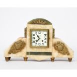 A French onyx and bronze mantel clock, rectangular section on bronze bud feet, the onyx panelled