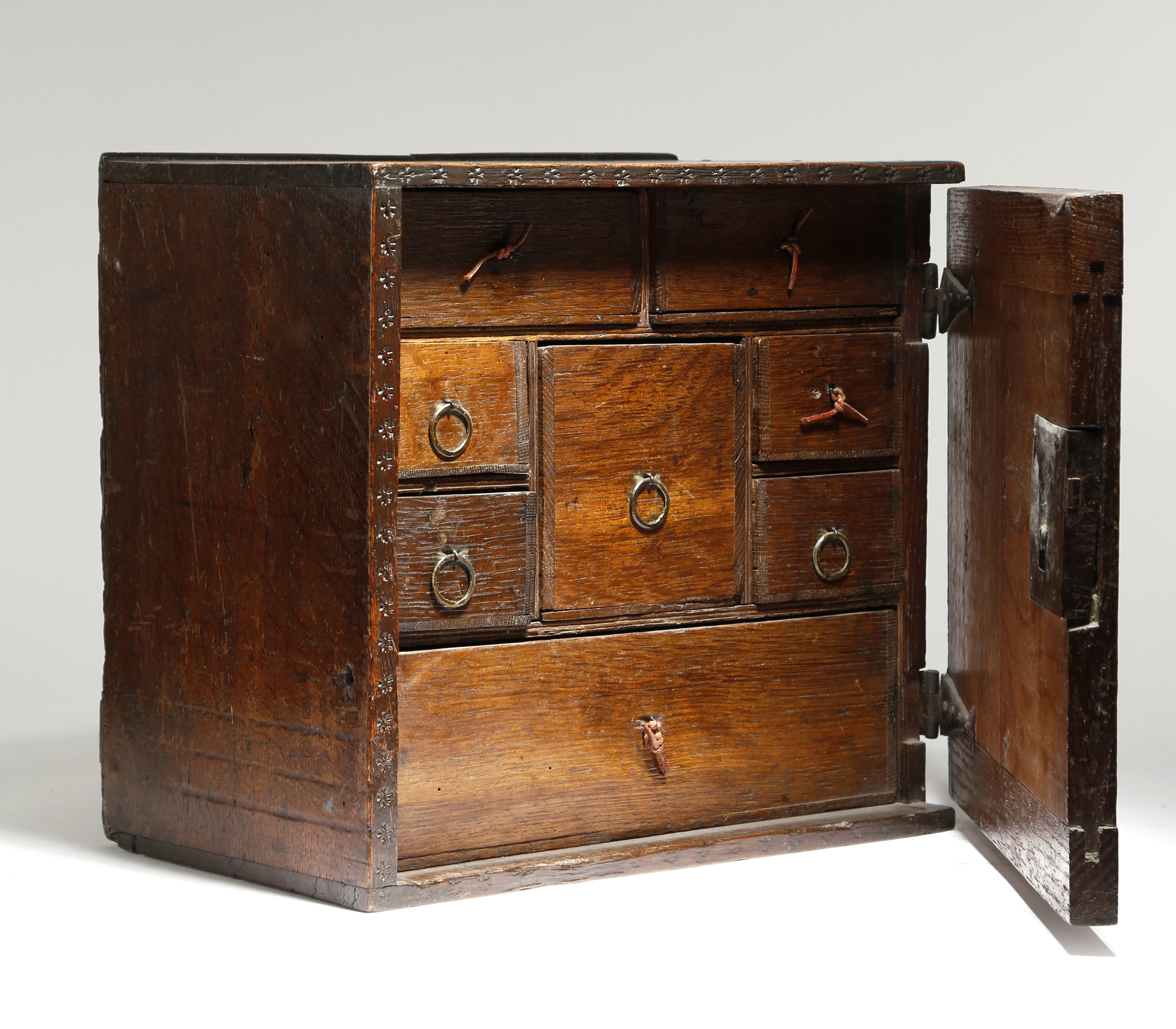 A CHARLES II OAK HANGING SPICE CUPBOARD LATE 17TH CENTURY with punched star decoration, the hinged - Image 2 of 2