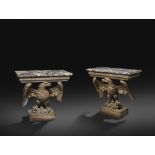 A PAIR OF GEORGE II AND LATER CARVED PINE EAGLE CONSOLE TABLES IN THE MANNER OF FRANCIS BRODIE MID-
