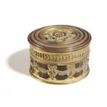 A FRENCH GILT BRASS AND CROCODILE LEATHER CIRCULAR BOX AND COVER EARLY 20TH CENTURY decorated with