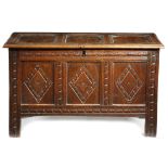 A CHARLES II OAK TRIPLE PANELLED COFFER LATE 17TH CENTURY the hinged top revealing an interior