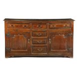 AN 18TH CENTURY OAK DRESSER PROBABLY WELSH, c.1750 the boarded top above three panelled front frieze