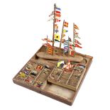 MARITIME INTEREST. A BOXED SET OF CARVED AND PAINTED WOOD NAVAL FLAGS 19TH CENTURY the stained