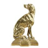 A VICTORIAN BRASS DOORSTOP IN THE FORM OF A SEATED DOG on a stepped breakfront base, with a