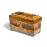 A 19TH CENTURY PENWORK STYLE TEA CHEST of sarcophagus shape, all over decorated with printed