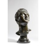 AFTER THE ANTIQUE. AN ITALIAN BRONZE GRAND TOUR BUST OF A YOUNG MAN 19TH CENTURY gazing upwards