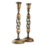 A PAIR OF KASHMIRI LACQUERED PAPIER-MACHE CANDLESTICKS EARLY 20TH CENTURY painted with a multitude