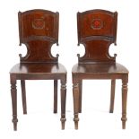 A PAIR OF REGENCY MAHOGANY HALL CHAIRS EARLY 19TH CENTURY each with a gorget back later painted with