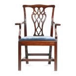 A GEORGE III MAHOGANY OPEN ARMCHAIR c.1770 with an interlaced and pierced splat back with