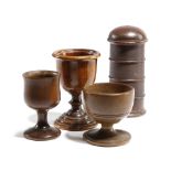 AN EARLY 19TH CENTURY TREEN SPICE TOWER together with a treen walnut turned egg cup and two other