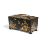 A BLACK JAPANNED TEA CHEST LATE 19TH / EARLY 20TH CENTURY of sarcophagus shape, decorated in gilt