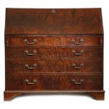 AN EARLY GEORGE III MAHOGANY BUREAU IN THE MANNER OF THOMAS CHIPPENDALE PROBABLY NORTH COUNTRY, c.