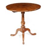 A GEORGE III YEW TRIPOD TABLE LATE 18TH CENTURY the boarded circular tilt-top above a turned stem