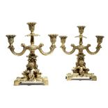 A PAIR OF 19TH CENTURY FRENCH BRONZE CANDELABRA each modelled with two cherubs, with scrolling