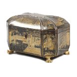 A CHINESE BLACK LACQUER TEA CHEST LATE 19TH CENTURY of fluted shape, decorated in gilt with panels