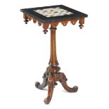 A VICTORIAN WALNUT AND MARBLE GAMES TABLE c.1870 the black marble top inlaid with a specimen