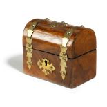 A SMALL VICTORIAN WALNUT TEA CADDY c.1870 with a domed lid and brass strapwork mounts, the