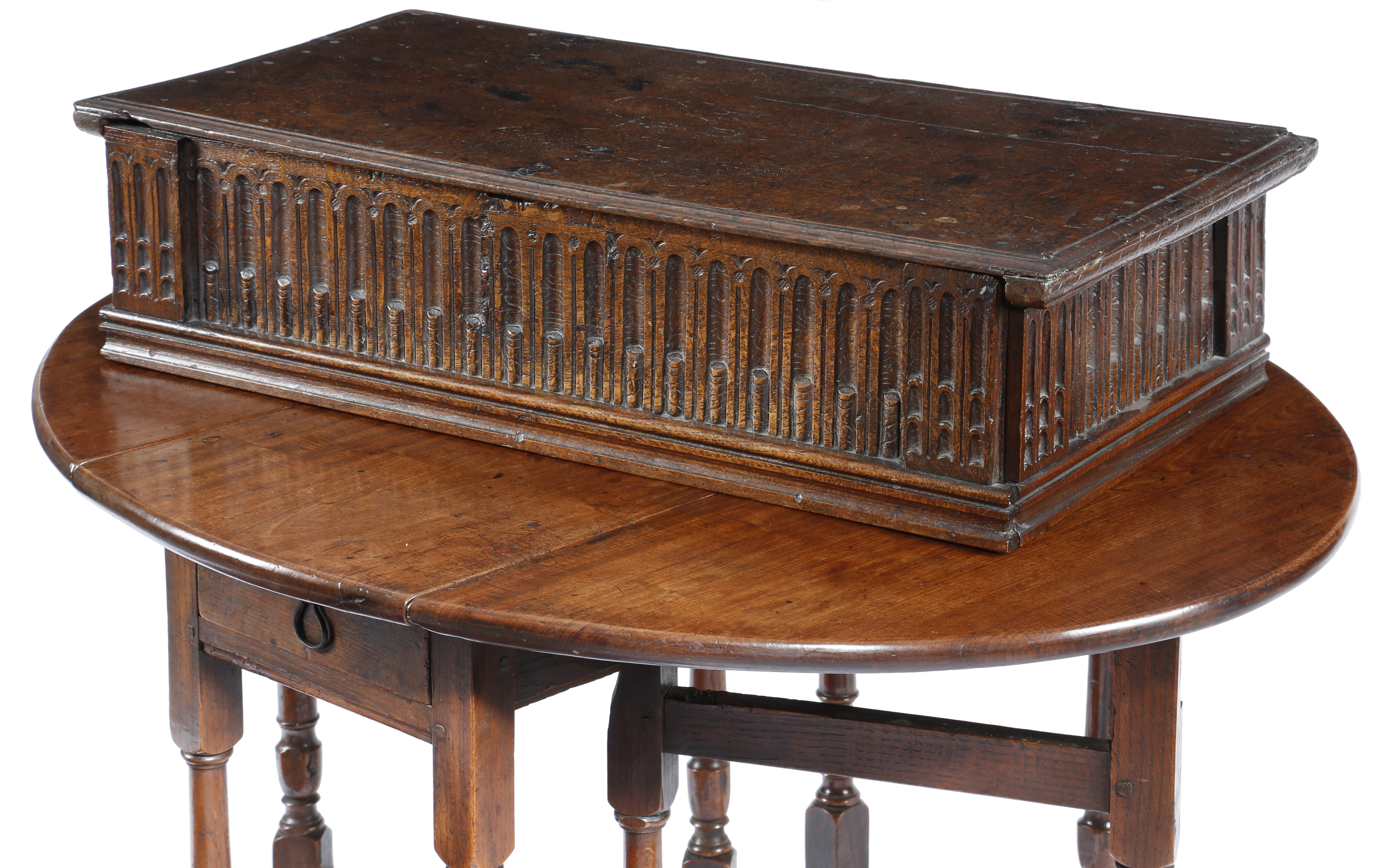 A 17TH CENTURY OAK BIBLE BOX c.1640-50 the hinged lid with incised decoration of urns of flowers,