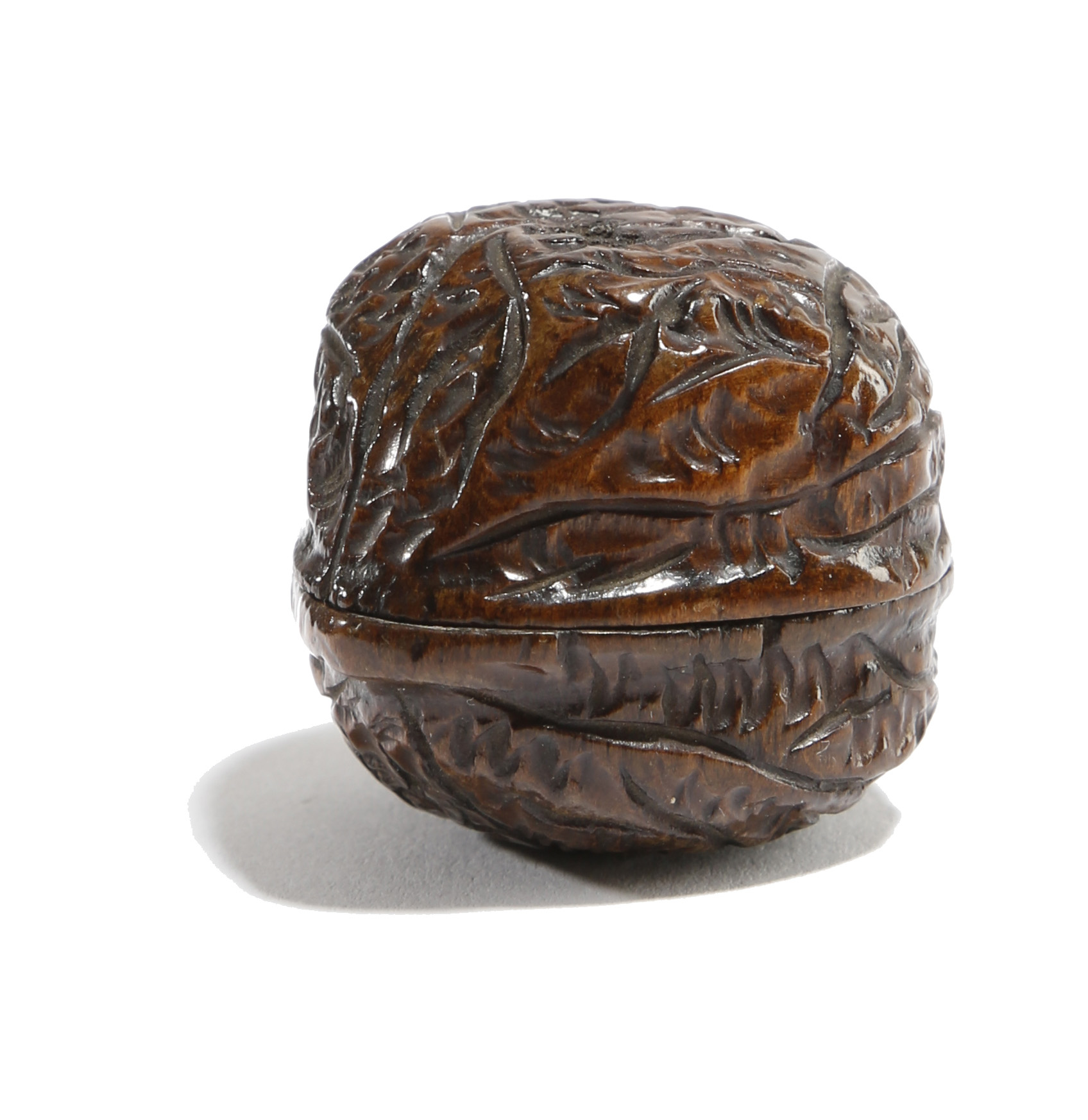A TREEN SNUFF BOX CARVED IN THE FORM OF A WALNUT PROBABLY 19TH CENTURY 3.2cm wide PROVENANCE 'A