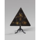 A RARE GEORGE I JAPANNED TRIANGULAR GAMES TABLE c.1720 the Chinese black lacquer tilt-top gilt